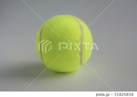 Single yellow tennis ball on the background 31820838