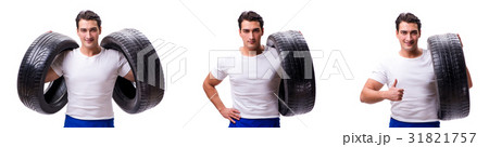Handsome tyre repairman isolated on white Handsome tyre repairman isolated on white 31821757