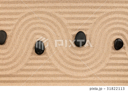Black stones and a zigzag from the sand. Black stones and a zigzag from the sand. 31822113