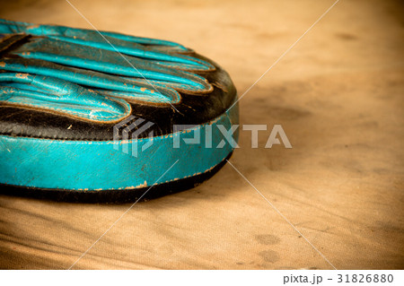 Old red boxing gloves on canvas Old red boxing gloves on canvas 31826880