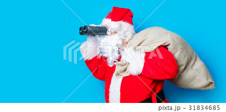 Funny Santa Claus have a fun with binoculars Funny Santa Claus have a fun with binoculars 31834685