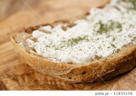 ricotta cheese with herbs on fresh rustic bread ricotta cheese with herbs on fresh rustic bread 31835156