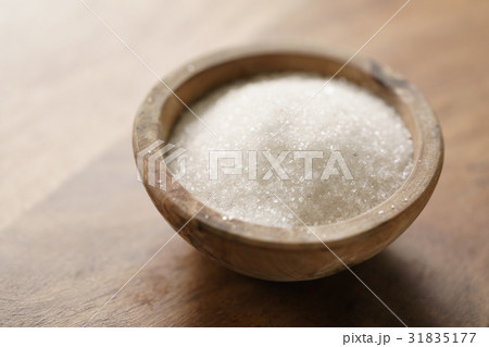 white sugar in wood bowl on wooden table white sugar in wood bowl on wooden table 31835177
