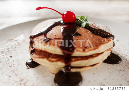 American breakfast. Pancakes with chocolate American breakfast. Pancakes with chocolate 31835735