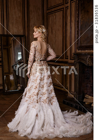 Woman in golden dress in retro style 31836536