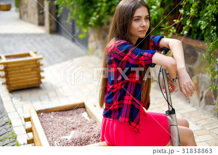 portrait of teenage girl with kick scooter portrait of teenage girl with kick scooter 31838863