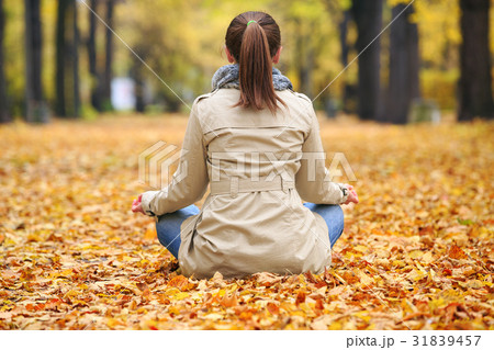 Woman meditator in the autumn park Woman meditator in the autumn park 31839457