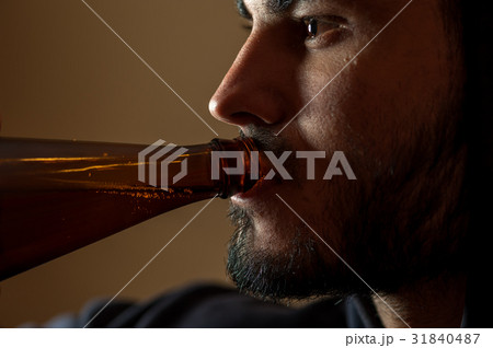 Young drunken man with beer bottle Young drunken man with beer bottle 31840487