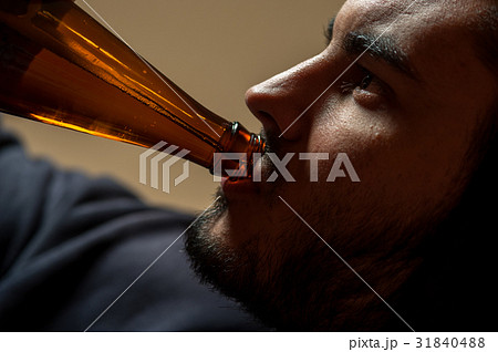 Young man drinking beer, closeup 31840488
