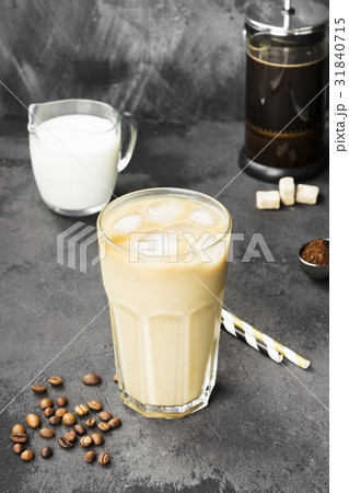 Ice coffee with milk in a tall glass Ice coffee with milk in a tall glass 31840715