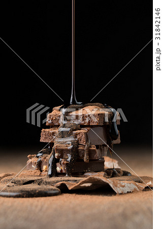 Chocolate slices topped with syrup 31842146