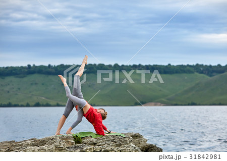 Young mother and little daughter practicing Young mother and little daughter practicing 31842981
