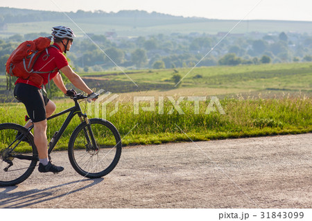 Young attractive cyclist riding mountain bike on Young attractive cyclist riding mountain bike on 31843099