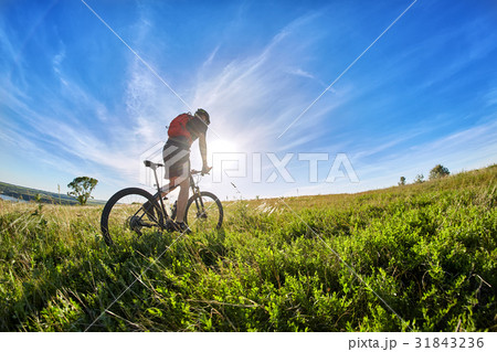 Wide angle of the cyclist with mountain bicyclist Wide angle of the cyclist with mountain bicyclist 31843236