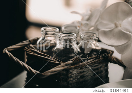 Glass Bottle in vintage Wicker basket. Decor box Glass Bottle in vintage Wicker basket. Decor box 31844492
