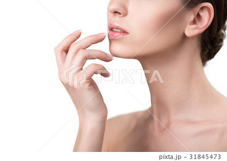 Pensive youthful woman using decorative make-up 31845473