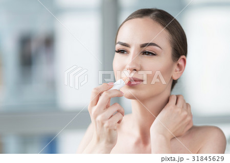 Thoughtful beautiful girl using decorative Thoughtful beautiful girl using decorative 31845629