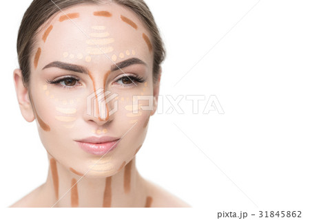 Attentive young lady using concealers Attentive young lady using concealers 31845862