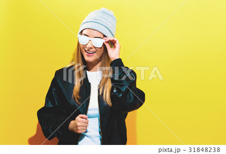Girl in trendy painted glasses in black jacket 31848238