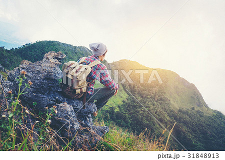 man sitting on mountain,adventure travel concept 31848913