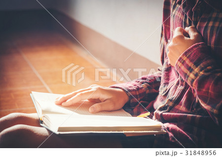 man praying on holy bible in the morning 31848956