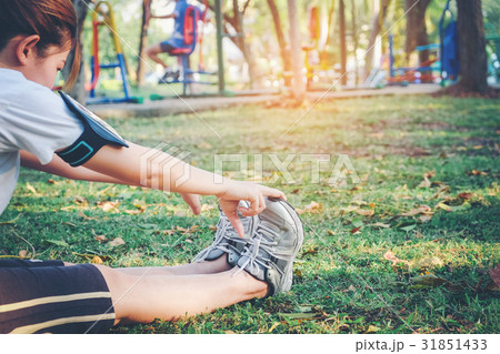women stretching after sport on the grass women stretching after sport on the grass 31851433