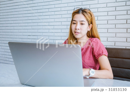 Asian girl working at a coffee shop sitting Asian girl working at a coffee shop sitting 31853130
