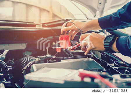Hands of car mechanic working in auto repair Hands of car mechanic working in auto repair 31854583