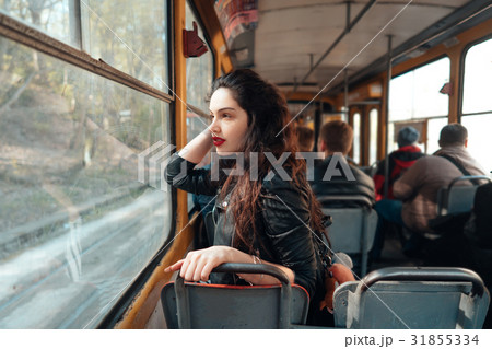 Woman traveling inside the tram 31855334