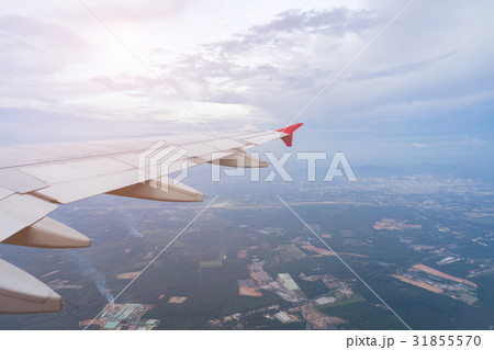 Aircraft wing against bluesky from its windows. 31855570