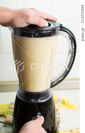 Using blender for making a smoothie 31855898