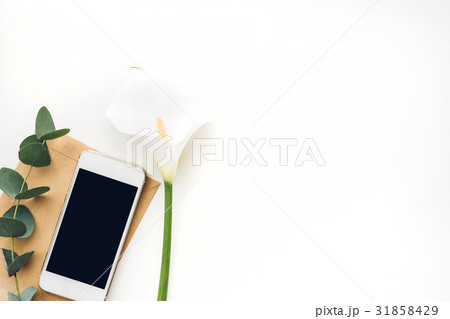 Mobile phone with blank screen and flowers on Mobile phone with blank screen and flowers on 31858429