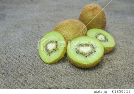 Ripe whole kiwi fruit and half kiwi fruit isolated Ripe whole kiwi fruit and half kiwi fruit isolated 31859215