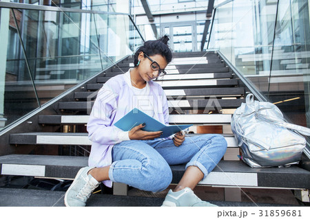 young cute indian girl at university building young cute indian girl at university building 31859681
