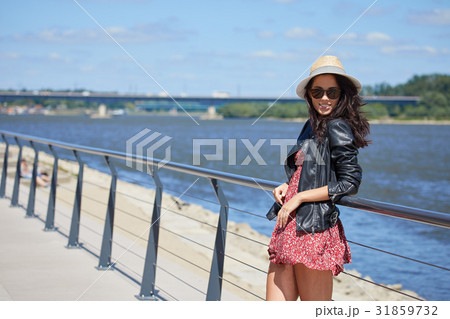 Beautiful Woman to Go in the City. Toned Photo with Copy Space. Beautiful Woman to Go in the City. Toned Photo with Copy Space. 31859732