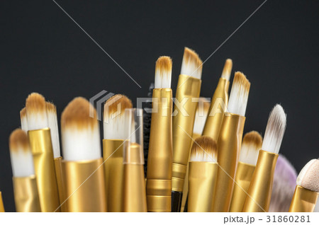 Brush dipping in eye liner Brush dipping in eye liner 31860281