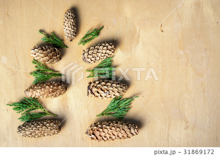 Christmas tree silhouette made from fir cones Christmas tree silhouette made from fir cones 31869172