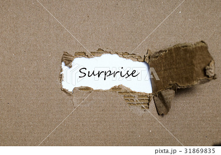 The word surprise appearing behind torn paper The word surprise appearing behind torn paper 31869835