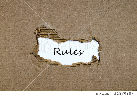The word rules appearing behind torn paper The word rules appearing behind torn paper 31870387