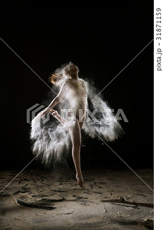 Sexy slim girl in white dust cloud studio portrait Sexy slim girl in white dust cloud studio portrait 31871159