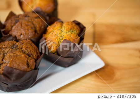 Muffins served in plate at coffee shop Muffins served in plate at coffee shop 31877308