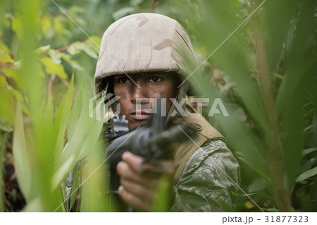 Military soldiers during training exercise with weapon Military soldiers during training exercise with weapon 31877323