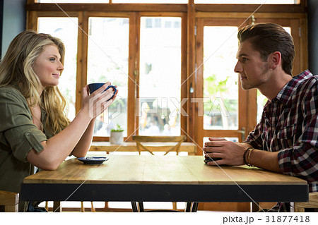 Loving young couple having coffee in cafeteria 31877418