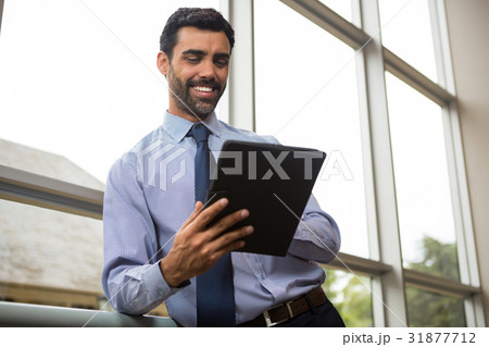 Businessman using digital tablet Businessman using digital tablet 31877712