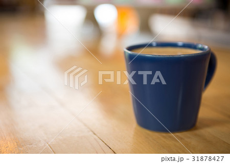 Coffee cup on wooden table in cafeteria Coffee cup on wooden table in cafeteria 31878427