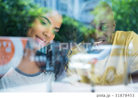Couple in coffee shop seen through window 31878453
