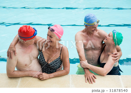 Happy senior couples enjoying in pool 31878540