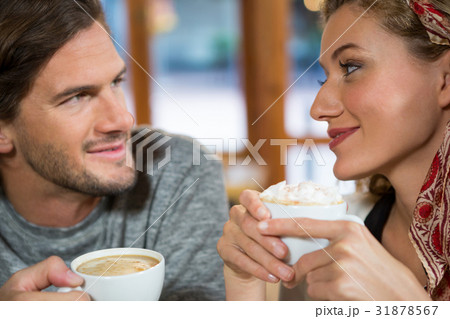 Close-up of romantic couple having coffee in cafeteria 31878567