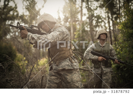 Military soldiers during training exercise with weapon Military soldiers during training exercise with weapon 31878792