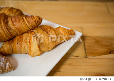 Croissant served in plate at coffee house 31879013